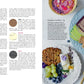 An open magazine spread featuring text about different types of wood and materials for boards on the left and an image on the right showcasing **The Art of the Board by Common Ground** with various cheeses, fruits, and crackers meticulously arranged on a charcuterie board.