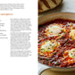 Open cookbook displaying a recipe for 'easy shakshuka eggs' as Common Ground Go-to Dinner, alongside a photograph of the completed dish in a pan.
