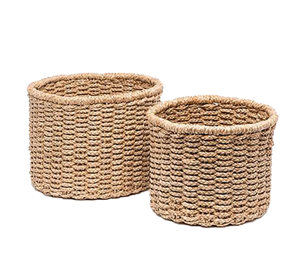 The Pigeon & Poodle Yuma Large Round Braided Seagrass Basket, crafted from natural fibers, is displayed on a white background.