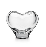 The Romance Small Vase by Simon Pearce is a clear, heart-shaped glass vase expertly crafted using traditional glassblowing techniques and photographed against a white background.