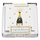 A clear box from Karen Adams holds “Congratulations Gift Enclosures”—hand-glittered cards with a champagne bottle, gold stars, and “congratulations!” on top.