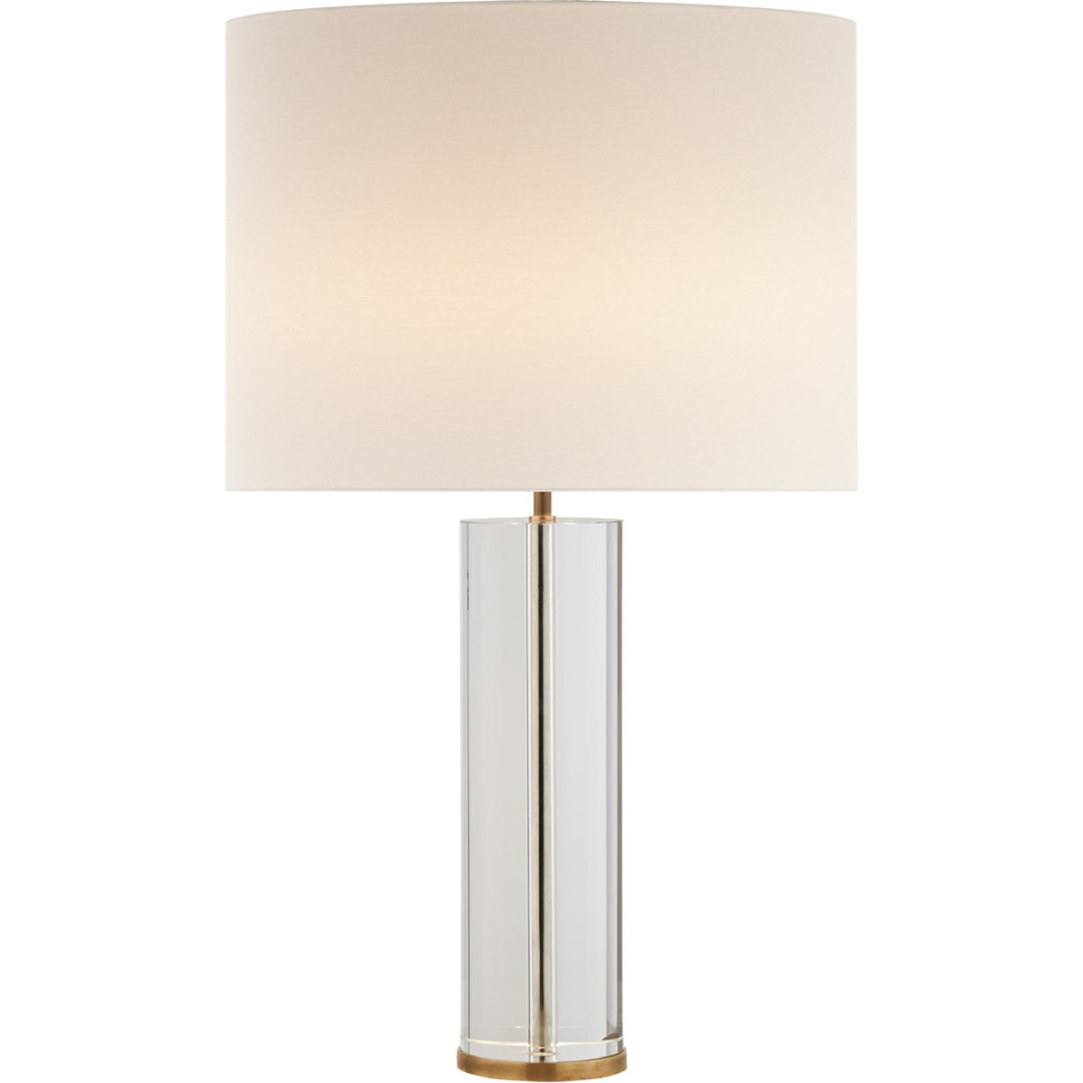 A Lineham Table Lamp by Visual Comfort with a cylindrical clear glass body, antique brass accents, and a large, round, beige lampshade.