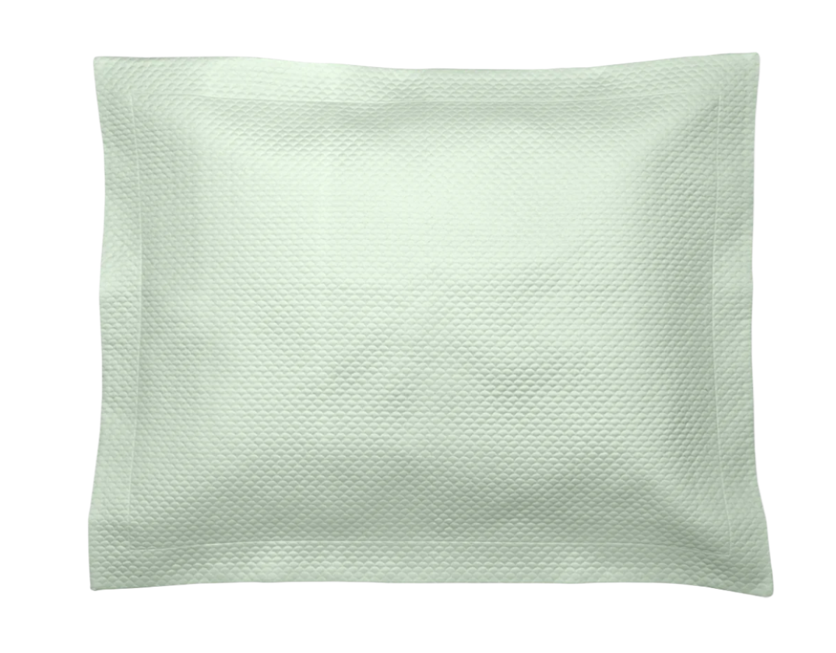 The Alba Bedding Collection Opal pillow by Matouk features a square, textured light green design with a subtle pattern in OEKO-TEX® certified fabric, shown against a white background.