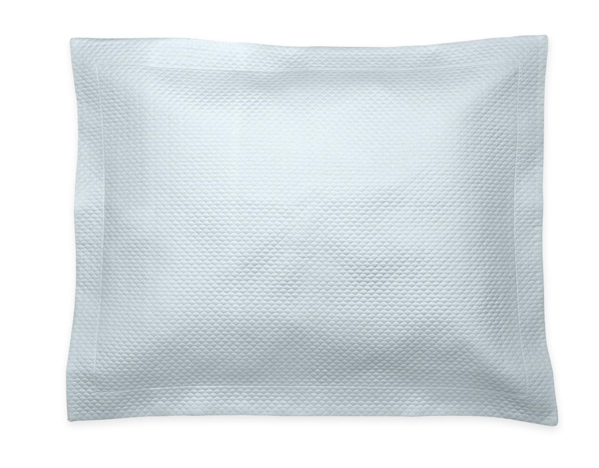 The Alba Bedding Collection pillow by Matouk, in Pool, is a rectangular white Egyptian cotton sateen pillow with a textured surface, displayed against a plain black background.