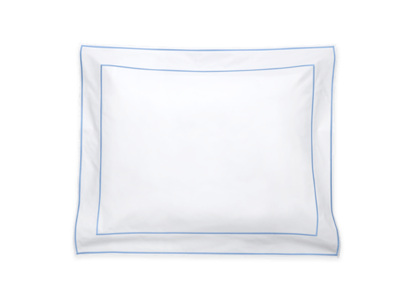 The Ansonia Bedding Collection, Ocean by Matouk features a white pillow with a blue rectangular border, crafted from luxurious Luca cotton percale, shown on a plain background.