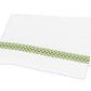An embroidered Matouk Astor Braid Bedding Collection, Grass sheet with green trim, made from Ceylon percale fabric.