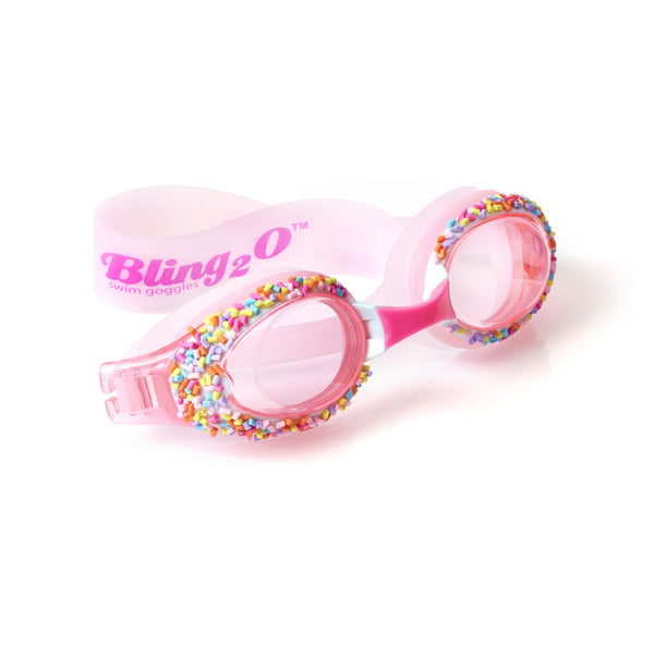 A pair of pink Angel Cake Pink children's swim goggles with multicolored rhinestones and colored faux candy sprinkles on a white background.