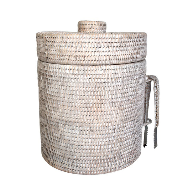 A Matahari Ice Bucket White Washed with a handle on it, woven.
