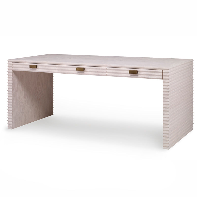 The Belmont Large Desk from Mr Brown is a modern, rectangular piece in the Belmont Collection with a rustic pine finish, featuring three center drawers adorned with metallic handles.