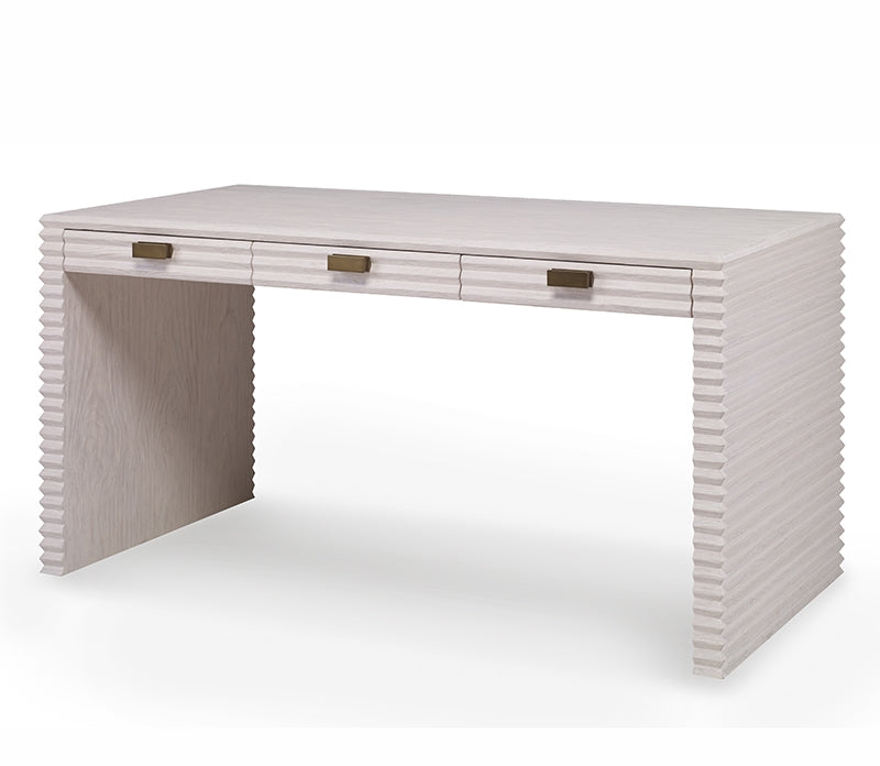 The Belmont Small Desk by Mr Brown, part of the Belmont Collection, is a modern wooden desk with storage drawers featuring a textured ribbed design and three compartments with dark handles.