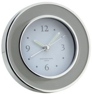 The Addison Ross Round Silver Alarm Clock features a white face, silver enamel frame, and displays the time as 1:50—an elegant addition to your bedside table.