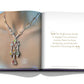 An open book reveals a person adorned with a colorful gemstone necklace on the left page and a quote about Assouline's search for exceptional gemstones, reflecting their cross-cultural influences, on the right page.