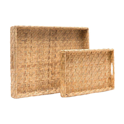 The Cadie Natural Flat Small Rattan Tray by Made Goods features a striking herringbone pattern and pairs with a larger, similarly designed tray for an eye-catching display.