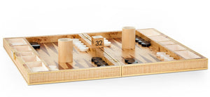 The Aerin Cane Backgammon Set showcases a burlwood interior, black and white checkers, two dice cups, a doubling cube set to 32, and dice arranged for play—all enhanced by elegant brass hardware.