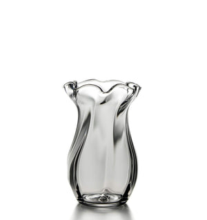 A Simon Pearce Chelsea Optic Vase, Small with a wavy shape on a white background.