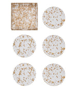 The Kim Seybert Stardust Clear/Gold Coaster Set includes five round acrylic coasters with gold flecks and a matching square holder, all showcased on a white background.