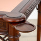 A Kindel Card Table with Pink Leather and a carved top.