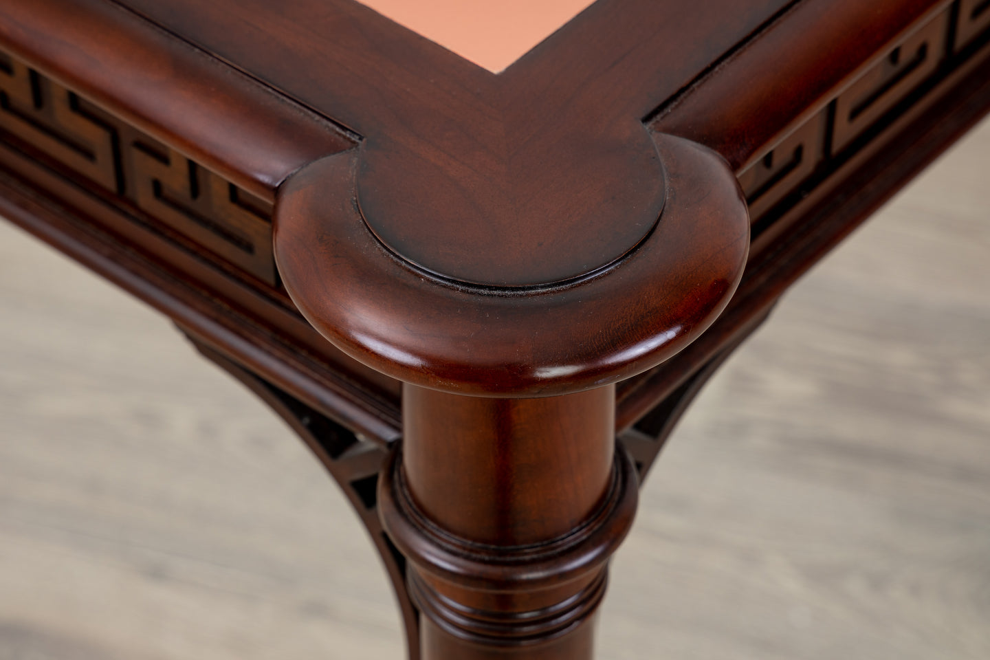 A close up of a Kindel Regency card table with a marble top.