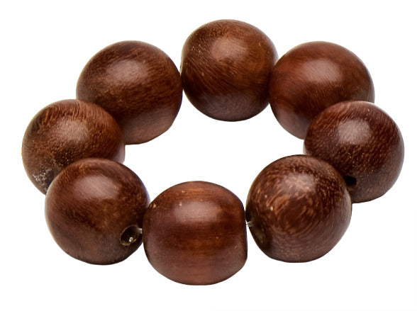 The Cocoa Wood Bracelet Napkin Ring Set by Deborah Rhodes features seven polished brown wood beads with small holes, creating an elegant accessory perfect for stylish place settings.