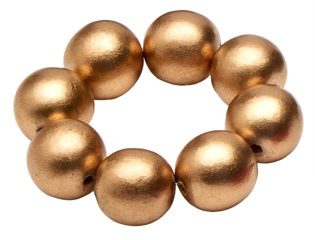 The Cocoa Wood Bracelet Napkin Ring Set by Deborah Rhodes features eight round, metallic gold beads in a circular arrangement, adding elegant style to your table décor.