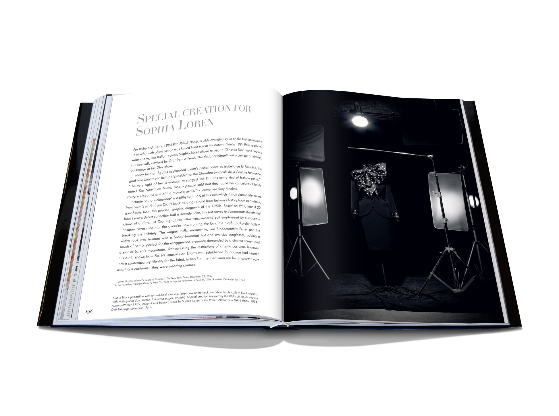 Open book showing a black-and-white photograph of a person on the right and text on the left. The text is titled "Special Creation for Sophia Loren." Studio lights are visible around the person, capturing an exquisite moment in haute couture, reminiscent of Dior IV by Gianfranco Ferré's iconic elegance.