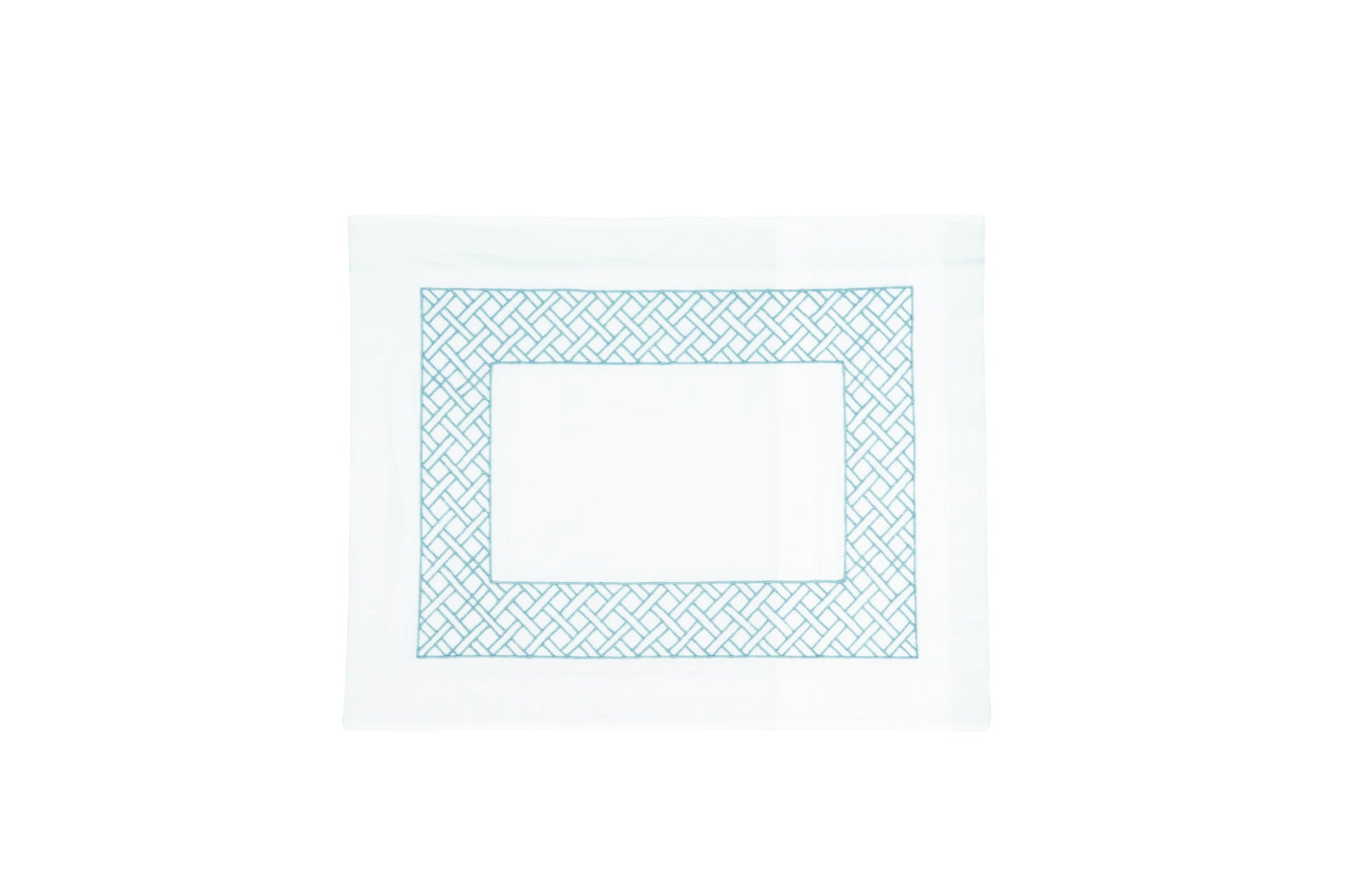 The Matouk HIVE Exclusive Rovella Bedding Collection in Dark Teal features a white rectangular placemat with a blue geometric border, crafted from Egyptian cotton percale and OEKO-TEX® Standard 100 certified for quality.