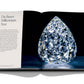 An open book showcasing a large, intricately cut natural diamond on the right page with text about "Diamonds: Diamond Stories" on the left page, epitomizing the craftsmanship of luxury jewelry houses by Assouline.