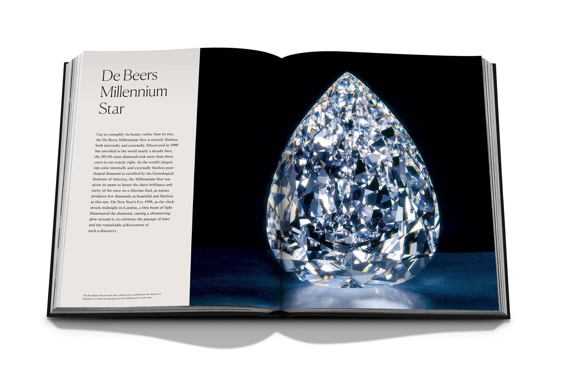 An open book showcasing a large, intricately cut natural diamond on the right page with text about "Diamonds: Diamond Stories" on the left page, epitomizing the craftsmanship of luxury jewelry houses by Assouline.