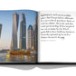The "Dubai Wonder" book by Assouline showcases Dubai's skyline photo on one page, with a testimonial celebrating its culture, entrepreneurial spirit, and iconic attractions—ideal for anyone contemplating Dubai tours.