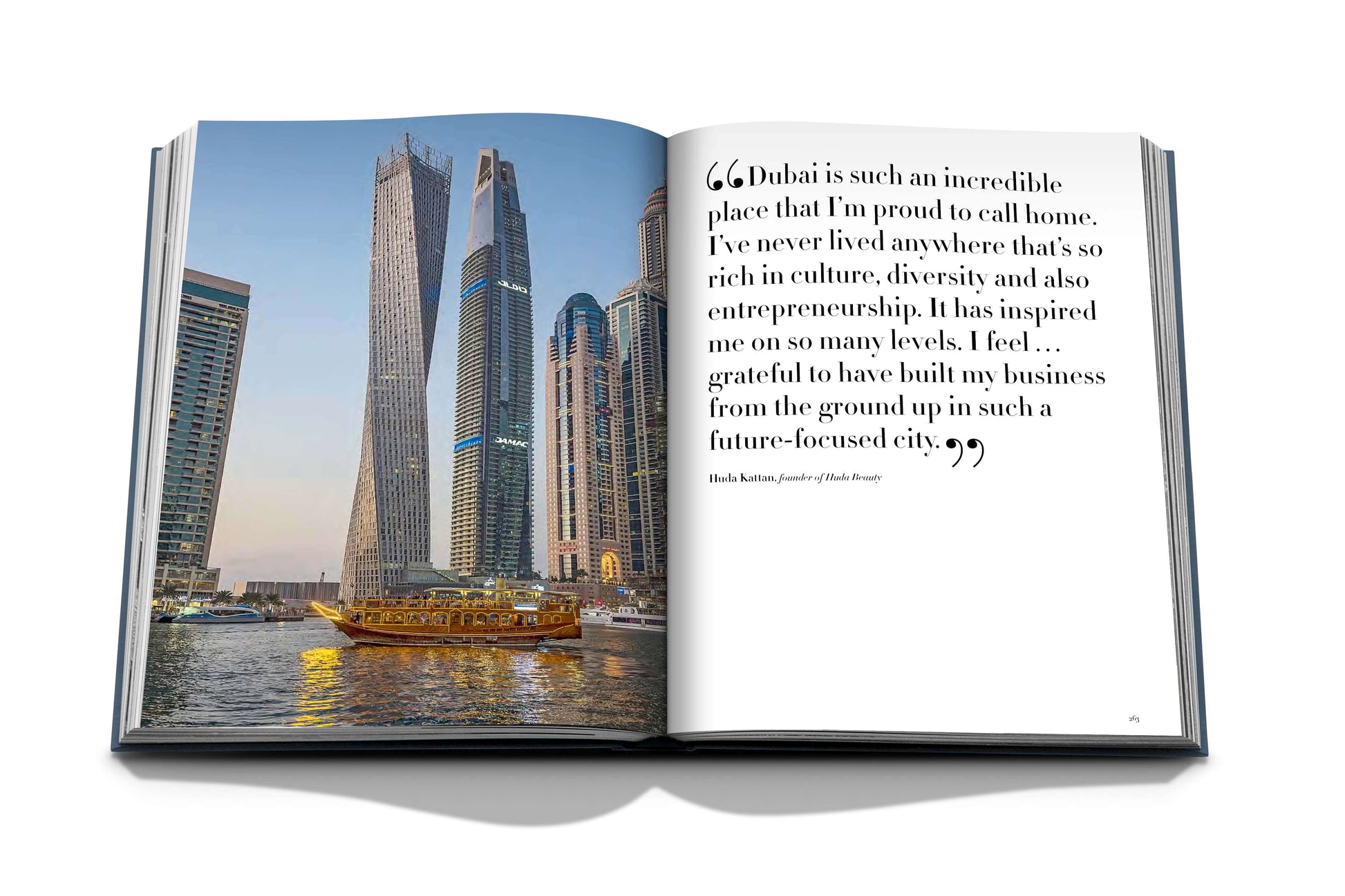 The "Dubai Wonder" book by Assouline showcases Dubai's skyline photo on one page, with a testimonial celebrating its culture, entrepreneurial spirit, and iconic attractions—ideal for anyone contemplating Dubai tours.