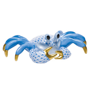 The Herend Ghost Crab, Blue features hand-painted blue and white scales, gold-colored claws and tips, and large eyes for an artistic touch against a white background.