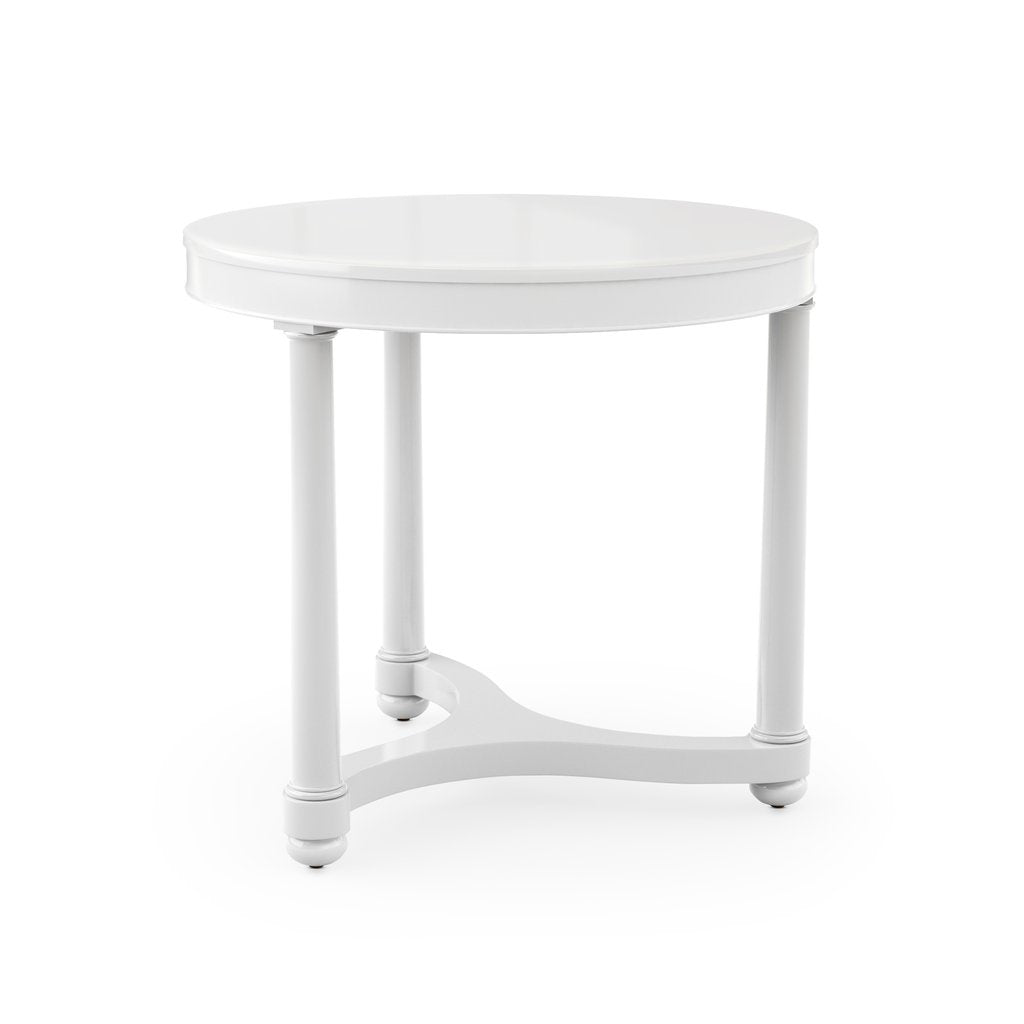 The Bunny Williams Gwendolen Side Table in White features a round top, three straight legs with a connecting base support, and a durable PU lacquer finish, shown against a plain white background.