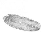 The Garden Banana Leaf Platter by Beatriz Ball is an extra large silver tray with detailed vein patterns, shaped like a long, narrow leaf—an elegant decorative serving platter for any occasion.