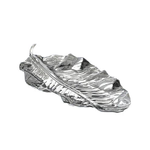 The Beatriz Ball Garden Zebra Leaf Platter is a silver-toned aluminum alloy tray, elegantly shaped like a detailed feather, displayed against a white background.