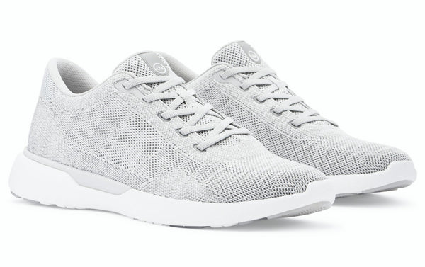 A pair of grey knit Peter Millar Glide V3 sneakers with white, lightweight outsoles.