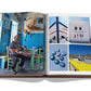 An Assouline book displaying a collection of images showcasing a person seated at a table in a rustic room, architectural details, and vibrant ceramic art typical of Greek Islands culture.