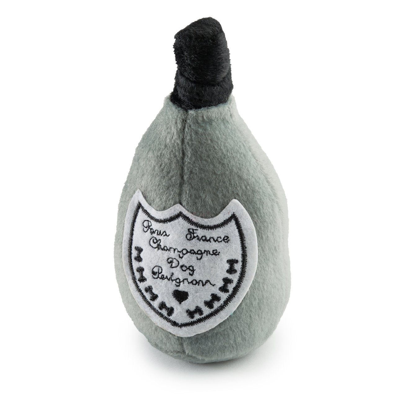 The Dog Perignonn Champagne Dog Toy Collection by Haute Diggity Dog features a plush, champagne-bottle shaped toy with a black top, white label, and built-in squeaker for playful pups.