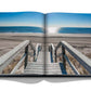 An open book with stairs leading to the beach, perfect for leisure activities in the Hamptons Private by Assouline.