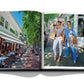 An Assouline Hamptons Private book with two people leisurely walking down a street.