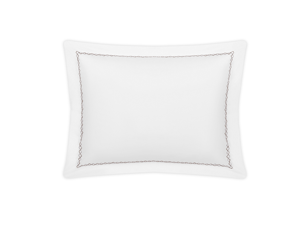 The Matouk Hatch Bedding Collection Oak pillow is a white square design in luxurious Ceylon percale with a thin black looping border, crafted from 520 thread count fabric and OEKO-TEX® Standard 100 certified for comfort and safety.