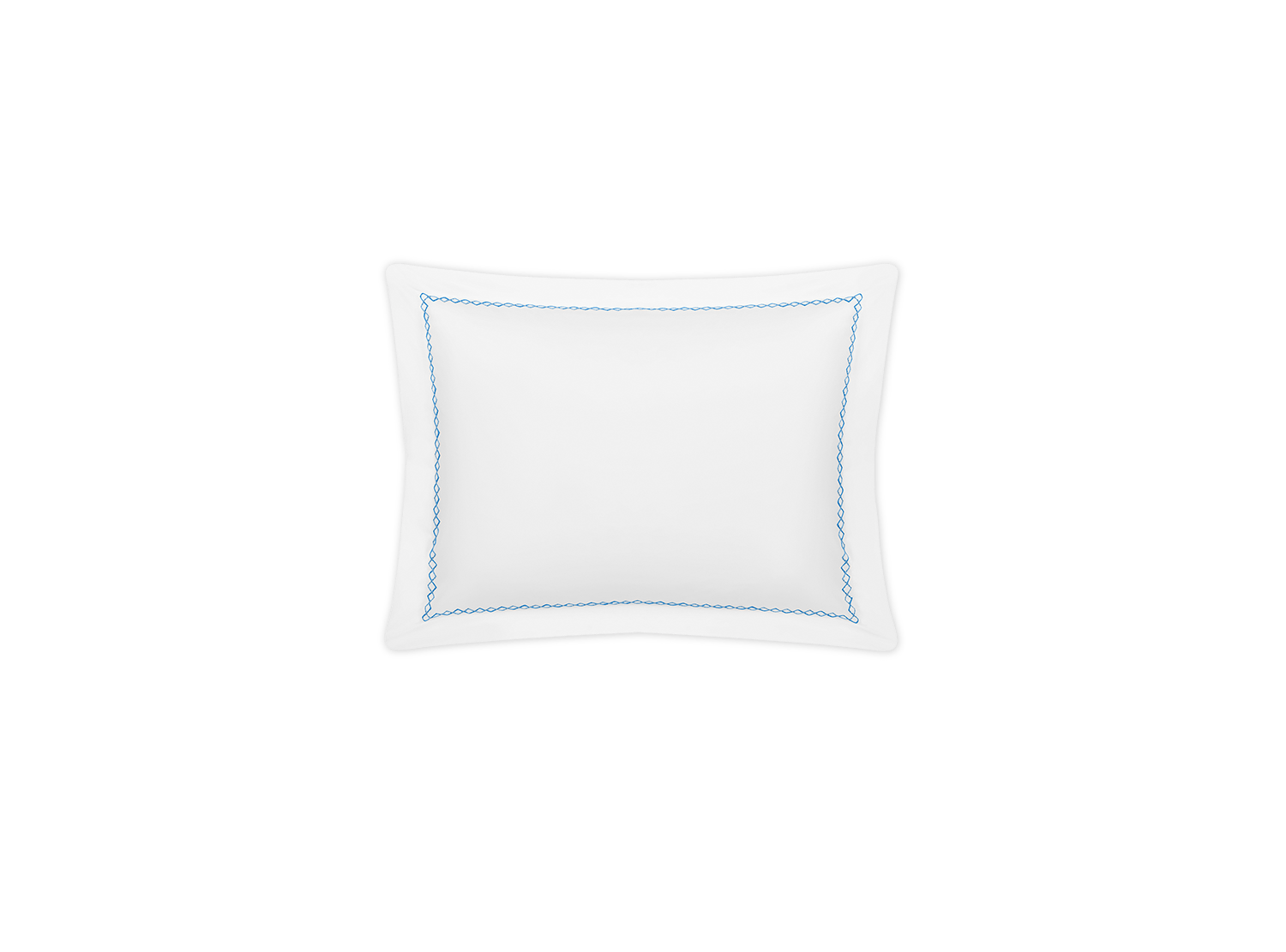 The Matouk Hatch Bedding Collection, Sky, features a white square pillow made from 520 thread count Ceylon percale with a blue border and black piping, shown against a green background.