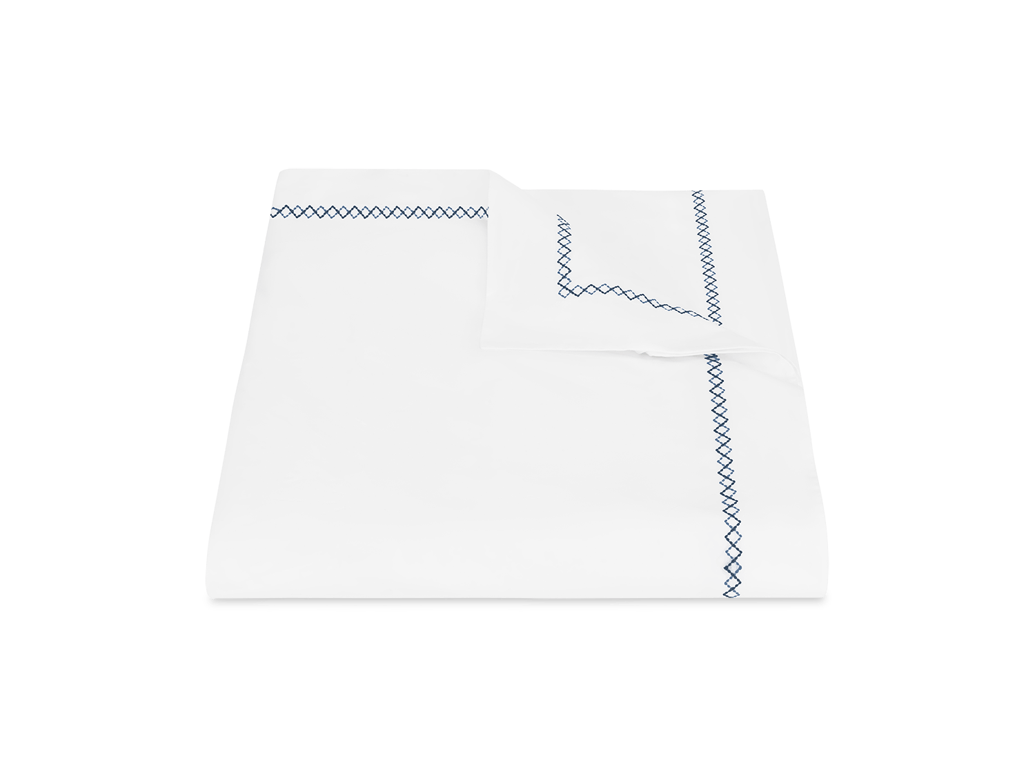 The Matouk Hatch Bedding Collection in Navy features folded white cotton percale sheets with a blue geometric border, 520 thread count, and OEKO-TEX Standard 100 certification, displayed on a plain background.