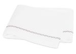 White folded towel with French knot decorative stitching from Matouk Hatch Bedding Collection, Oak.