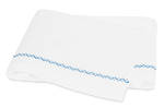 Matouk Hatch Bedding Collection, Sky cloth napkins with a blue zigzag pattern on the edges, featuring French knot stitching, set against a white background.