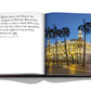 Open book showing a quote about Havana on the left page and a nighttime cityscape with illuminated buildings and palm trees on the right page, reflecting the city's spirit during its cultural renaissance. The book is titled *Havana Blues* by Assouline.