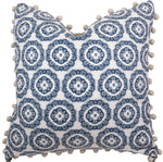 The Tassel Inverted Medallion Navy Pillow by Hive Custom Pillows features a blue and white floral design with pom-pom trim, handmade in the USA.