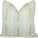 The Milos in Emerald Pillow by Hive Custom Pillows is a handmade 22" x 22" square pillow with a white base and green geometric patterns, piped edges, a slightly indented top, and custom down fill. Made in the USA for stylish comfort.