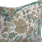 Close-up of the Cormnandal Teal Pillow by Hive Custom Pillows, featuring a white base with beige and teal floral patterns and a teal piped edge.