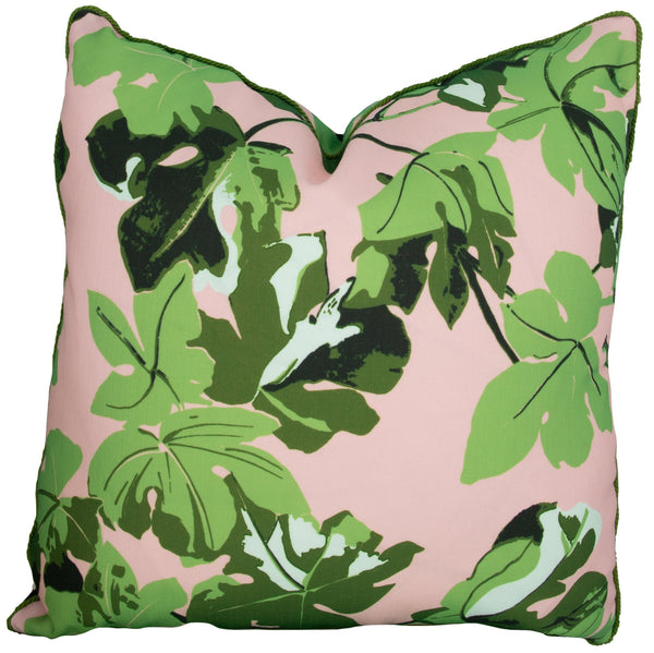 A handmade, 22" x 22" pillow with a pink background is covered with a vibrant green leaf pattern is the Pink Fig Leaf Outdoor Pillow by Associated Design.