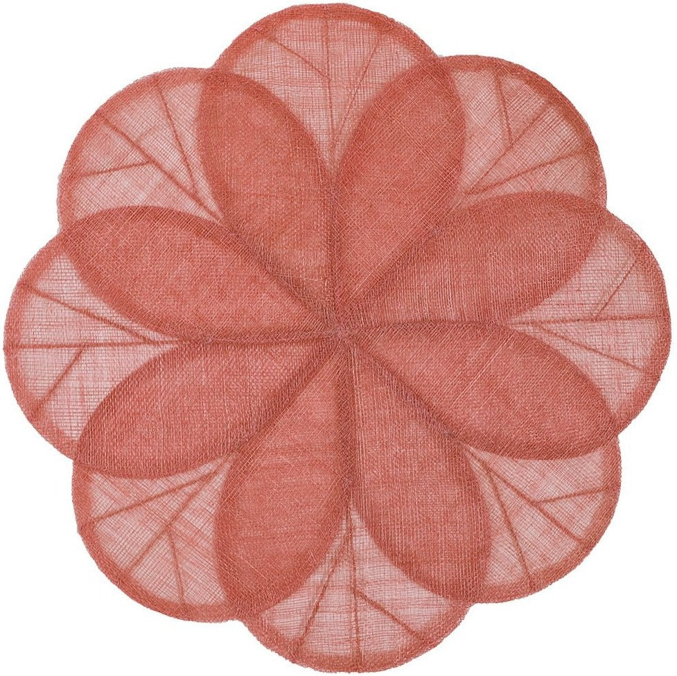 The Deborah Rhodes Sinamay Flower Placemat Collection Set features circular sinamay placemats with a flower petal pattern in muted reddish tones and overlapping translucent segments for a sheer floral effect.